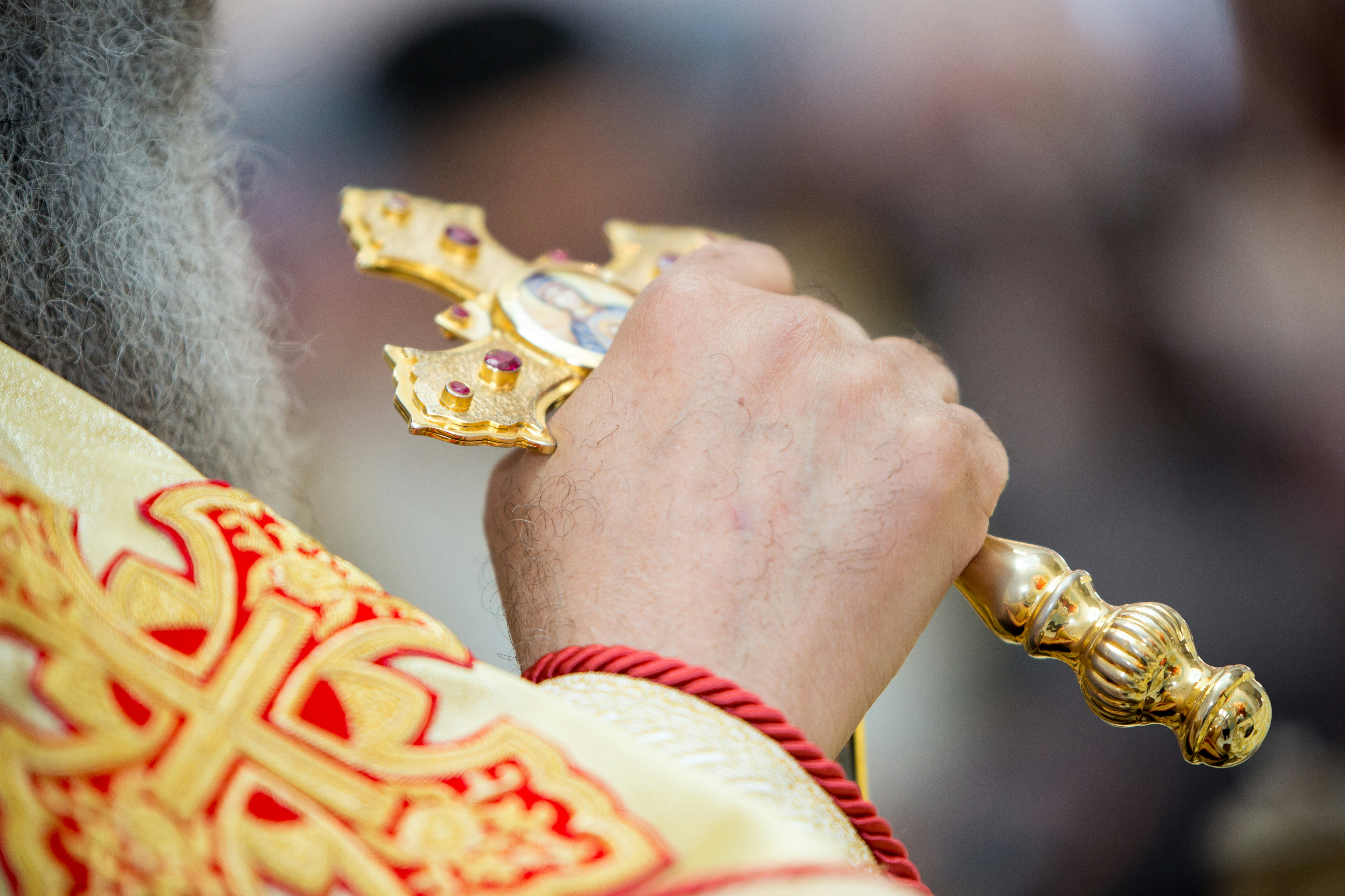 Image of Coptic Cross in priest's hand
